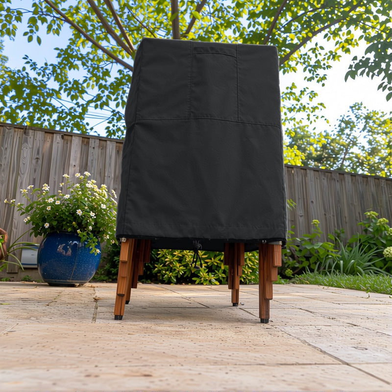 Black - Khomo Gear stackable chair outdoor cover, low-angle front view on the patio
