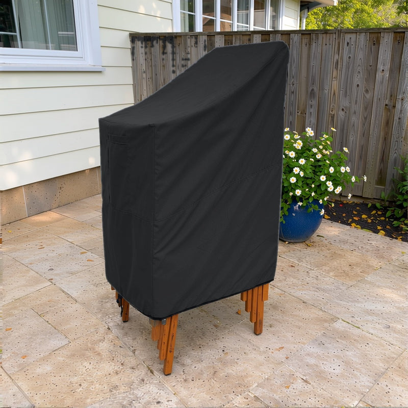Black - Khomo Gear stackable chair outdoor cover, three-quarter view on the patio
