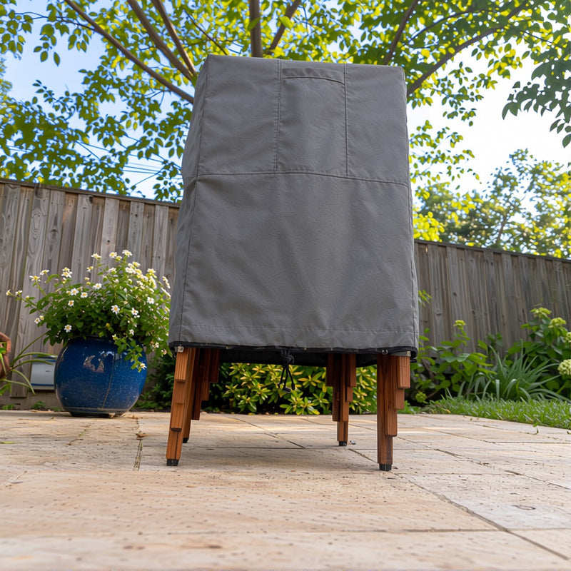 Gray - Khomo Gear stackable chair outdoor cover, low-angle front view on the patio