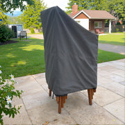 Gray - Khomo Gear stackable chair outdoor cover, side view in the garden