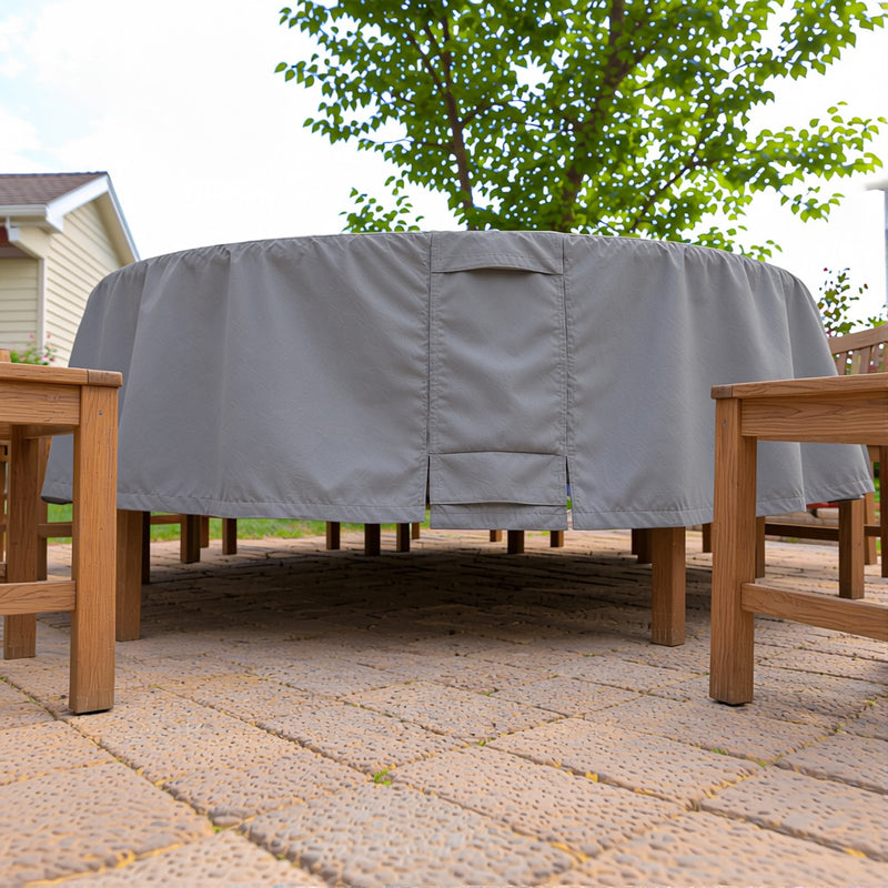 Low-angle view of the Khomo Gear round table cover hem on a paver patio