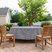Khomo Gear round table cover on a patio under a shade tree