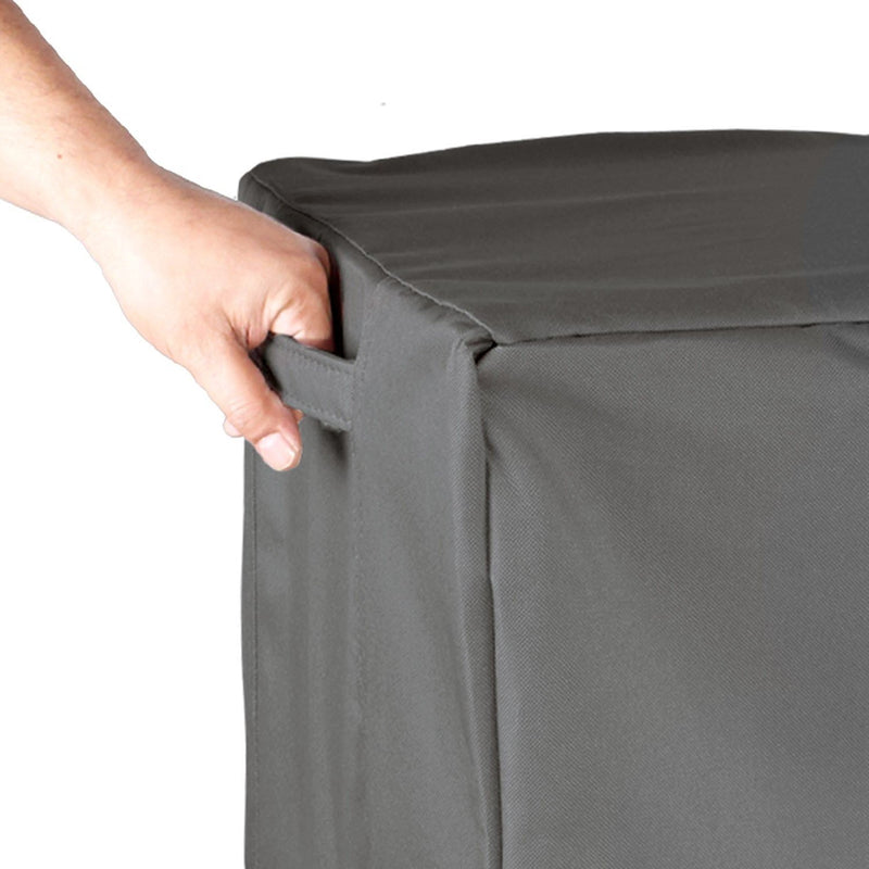 Grey - Hand lifting the Khomo Gear air conditioner cover by its side handle