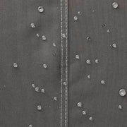 Close-up of the water-resistant fabric on the Khomo Gear AC cover with water beading on the surface