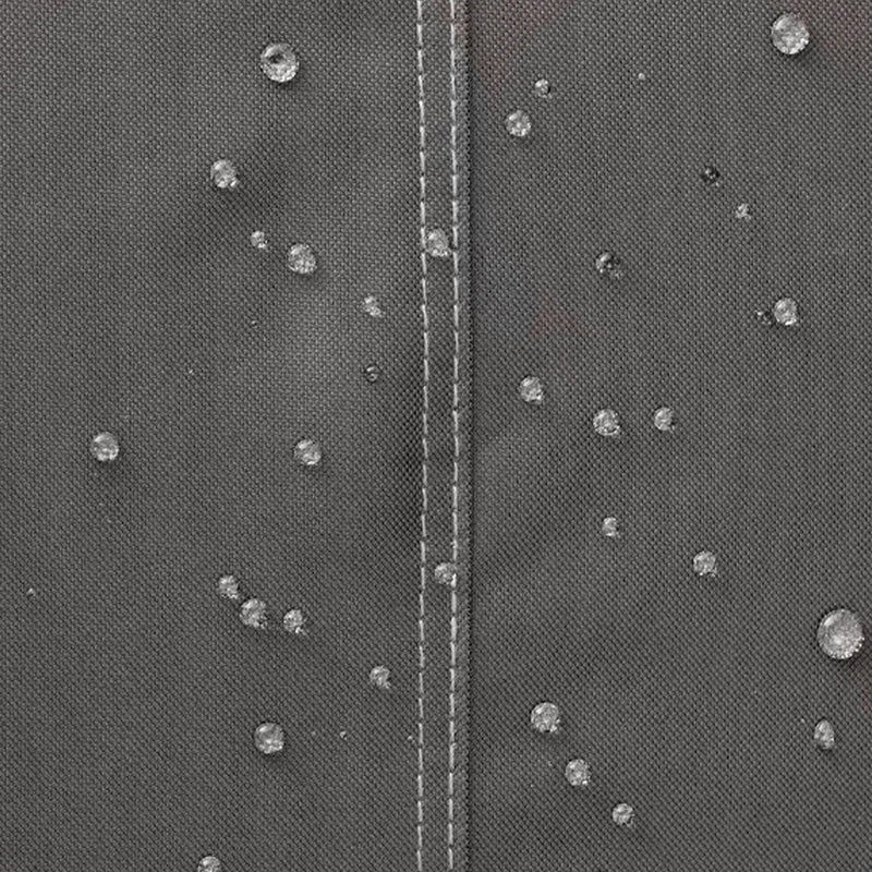 Close-up of the water-resistant fabric on the Khomo Gear AC cover with water beading on the surface