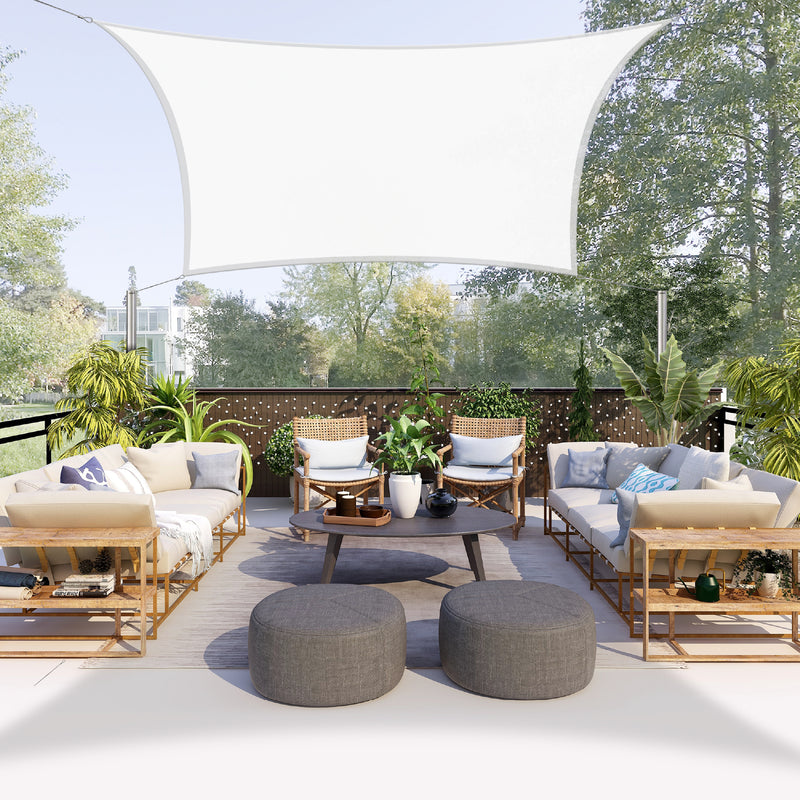 Khomo Gear rectangle shade sail over a patio seating area with outdoor sofas