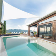 Khomo Gear white triangle shade sail over a pool and patio with mountain views